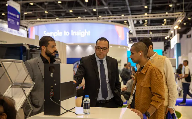 An image showcasing four professional people discussing the business in a conference booth